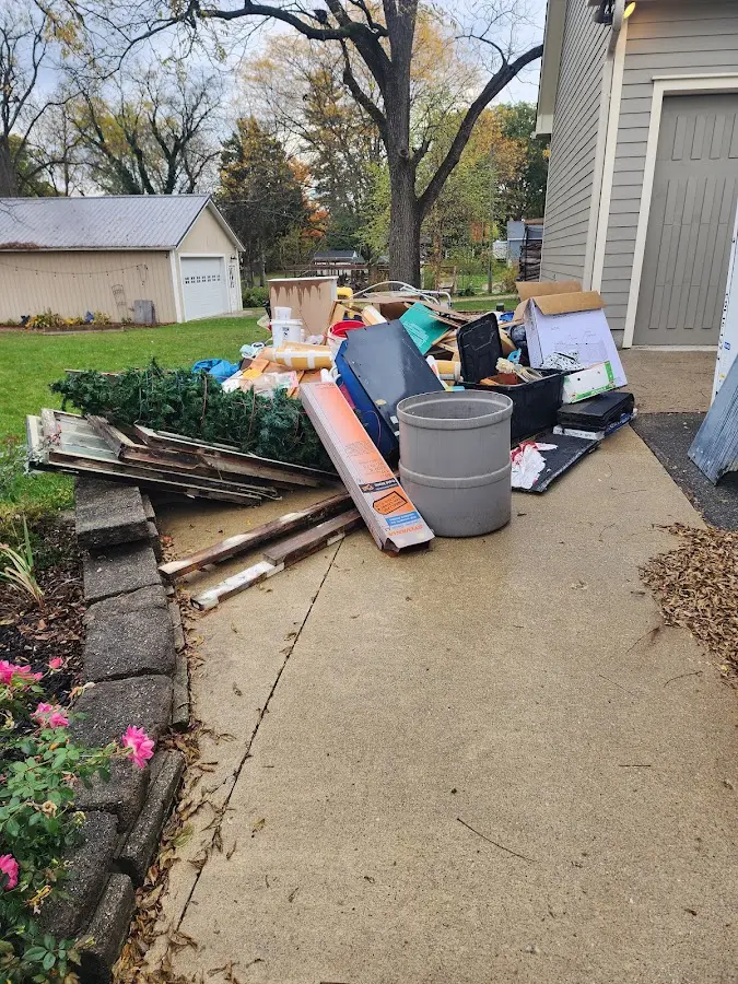 Dumpster being loaded with debris for 3 Yard Dumpster Rental in Sandy Oaks